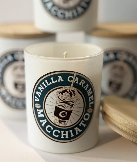 Candle with 'Vanilla Caramel Macchiato' label on a white surface